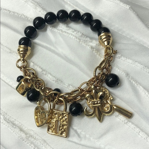 Black and gold charm bracelet. - Picture 1 of 1